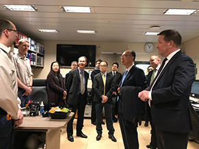 The delegation of the Hong Kong Maritime and Port  Board led by the Secretary for Transport and Housing, Mr Frank Chan Fan, visited Bergen, Norway for the last leg of their Nordic tour today (March 15, Bergen time). Photo shows Mr Chan (front row, second right) and the delegation chatting with the staff of an environmental friendly cruise liner.